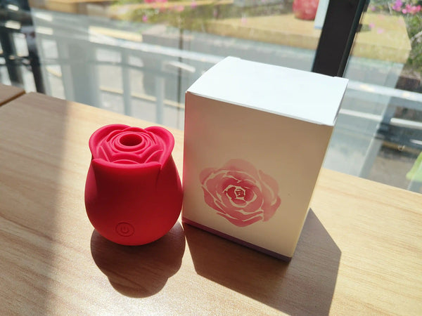 a rose toy and a pink box